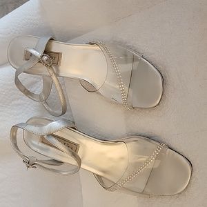 Clear with rhinestones, clear 2 1/2 in. heels.  9W but fits a little narrow .